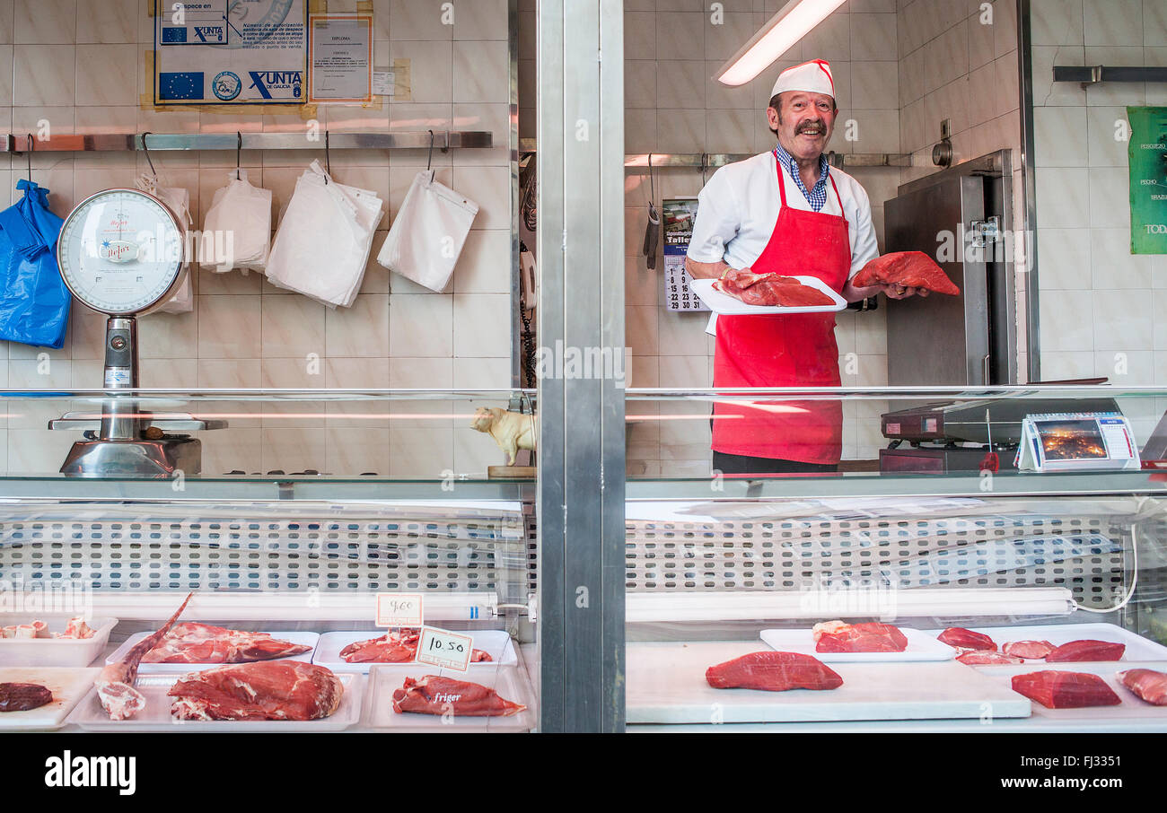 Veal, butcher in `Mercado de la Plaza de San Agustin´, Coruña city, Galicia, Spain Stock Photo